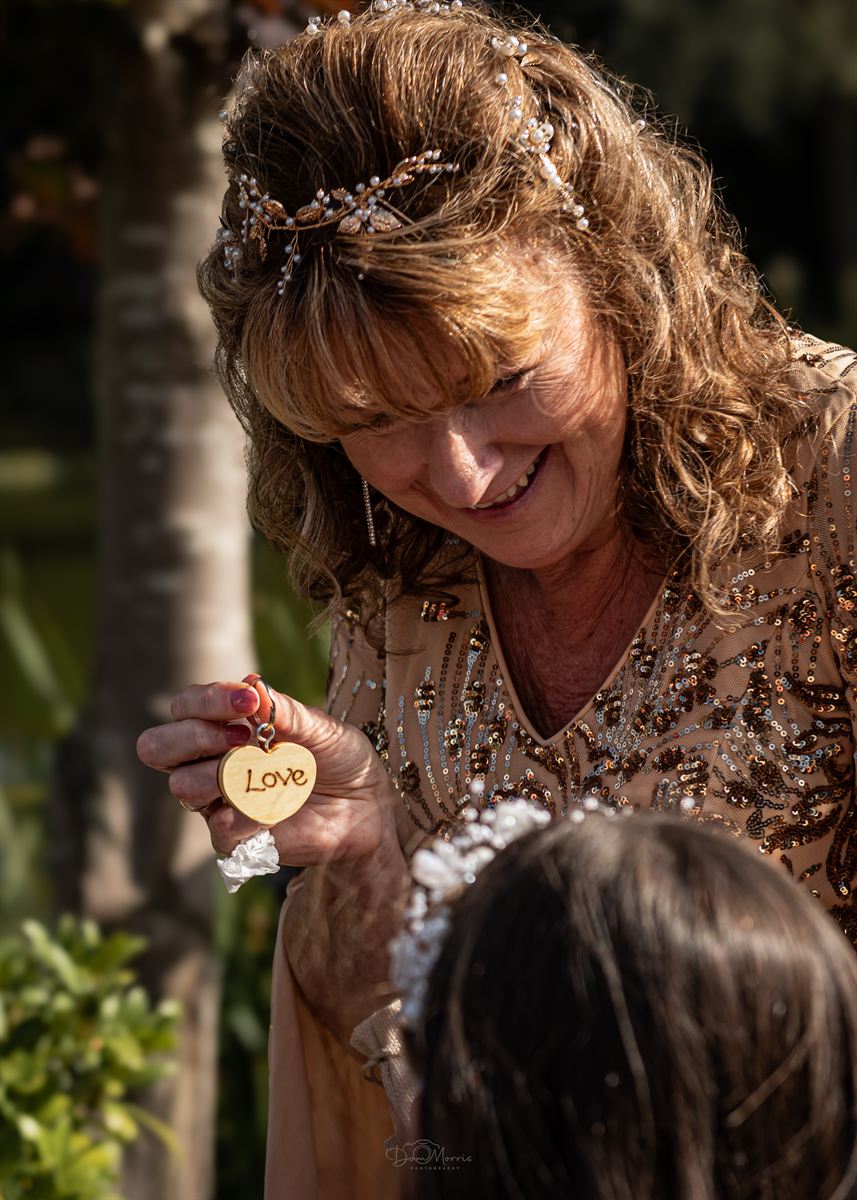 Wedding guests laughing during outdoor ceremony