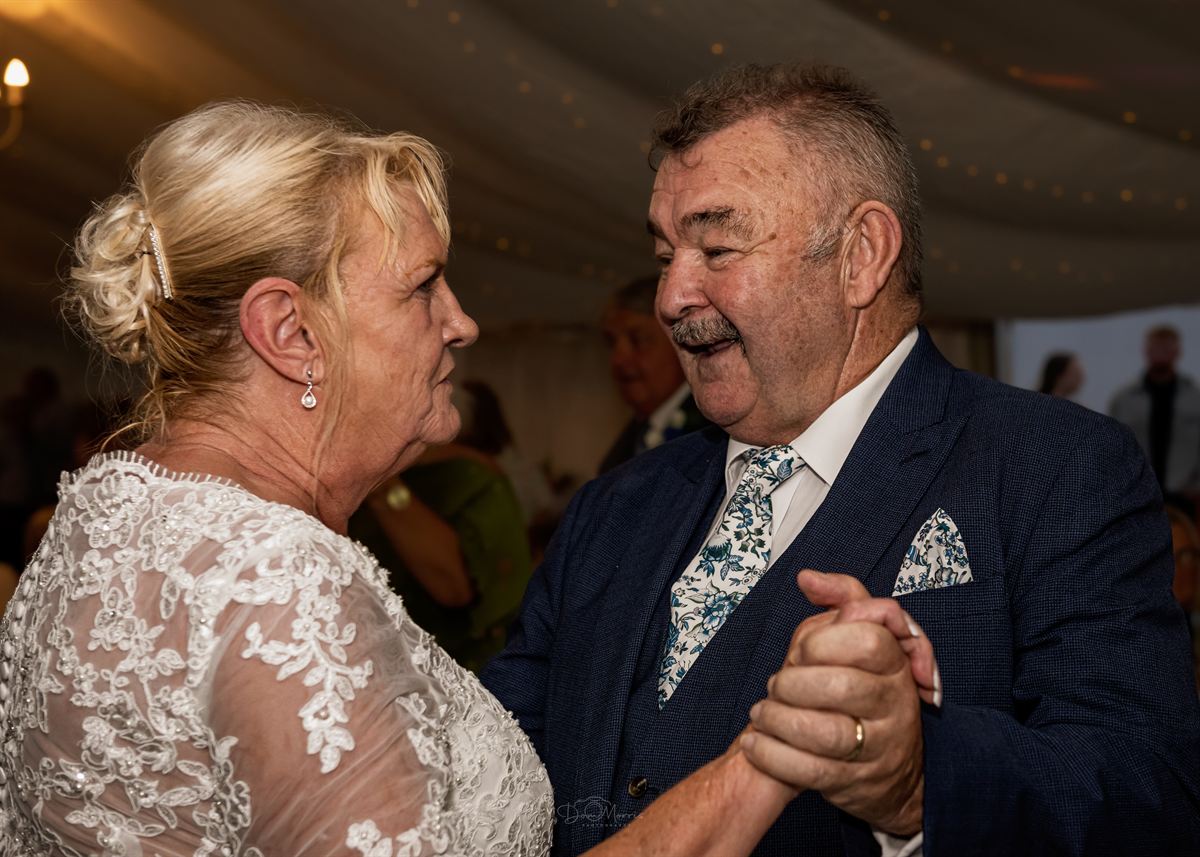 Best man speech with guests laughing in background